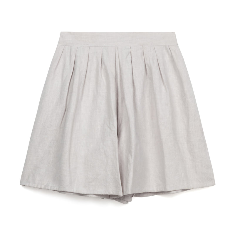 Lightweight playful linen shorts with feature pleating. Perfect paired with the Kate Sheridan Edie Top.  The Pleat Play Shorts by Kate Sheridan have a relaxed fit making them easy to move around in. Finished with an elasticated waistband for comfort and two side pockets.  Made in England by Kate Sheridan.