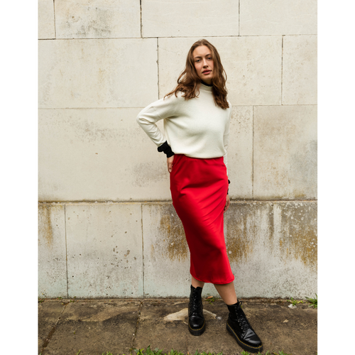 The Ridley red satin slip skirt is an elegant bias cut midi length skirt in satin.   With a hidden elastic inside the waist band the skirt is easy to pull on, comfortable to wear and will become a well loved wardrobe staple, adored for the incredibly flattering fit. 