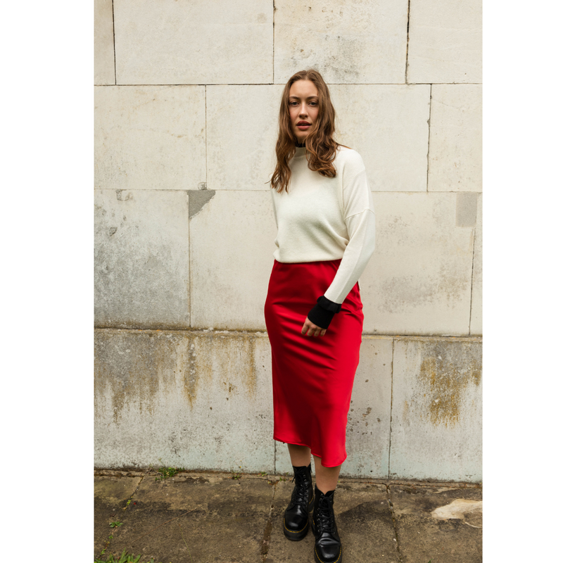 The Ridley red satin slip skirt is an elegant bias cut midi length skirt in satin.   With a hidden elastic inside the waist band the skirt is easy to pull on, comfortable to wear and will become a well loved wardrobe staple, adored for the incredibly flattering fit. 