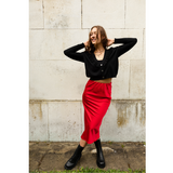 The Ridley red satin slip skirt is an elegant bias cut midi length skirt in satin.   With a hidden elastic inside the waist band the skirt is easy to pull on, comfortable to wear and will become a well loved wardrobe staple, adored for the incredibly flattering fit. 