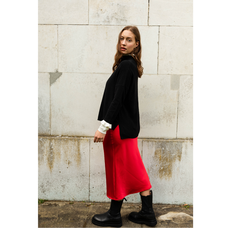 The Ridley red satin slip skirt is an elegant bias cut midi length skirt in satin.   With a hidden elastic inside the waist band the skirt is easy to pull on, comfortable to wear and will become a well loved wardrobe staple, adored for the incredibly flattering fit. 