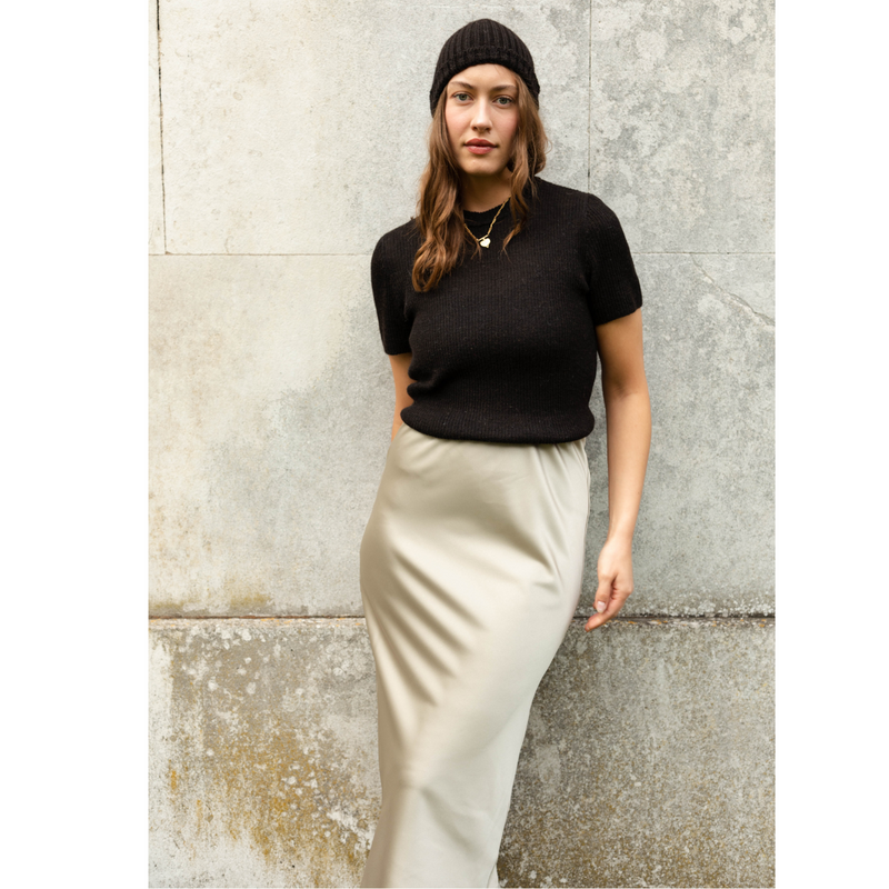 The Ridley oyster satin slip skirt is an elegant bias cut midi length skirt in satin.   With a hidden elastic inside the waist band the skirt is easy to pull on, comfortable to wear and will become a well loved wardrobe staple, adored for the incredibly flattering fit. 