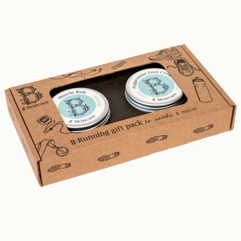 B Running Gift Pack by B Skincare. Contains two easily transportable 60ml tins of cooling Peppermint Foot Cream to soothe and nourish hot, dry & tired feet and soothing Muscle Rub with ginger, eucalyptus, lavender and juniper, to ease and restore sore muscles, the perfect gift for every runner.