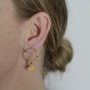 Textured earrings with a unique rhombus tag made out of fairmined gold vermeil by April March Jewellery, sold by Percy Langley