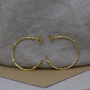 Large textured hoops made out of fairmined gold vermeil by April March Jewellery, sold by Percy Langley