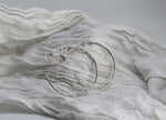 Large textured hoops made out of recycled silver by April March Jewellery, sold by Percy Langley