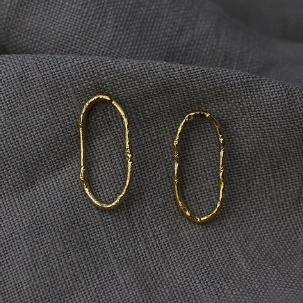 Textured loop earrings made out of fairmined gold vermeil by April March Jewellery, sold by Percy Langley