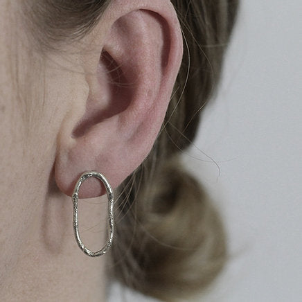 Textured loop earrings made out of recycled silver by April March Jewellery, sold by Percy Langley