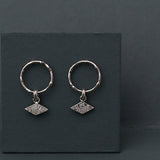 Textured shape earrings with a rhombus tag made out of recycled silver by April March Jewellery, sold by Percy Langley
