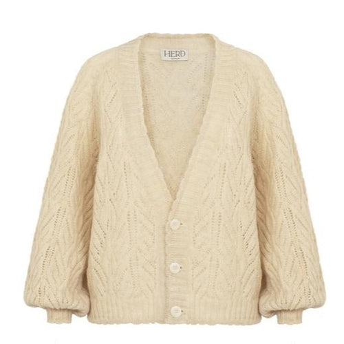 The Wyre Cardigan, made from Herd Wool, has raglan shoulders, blouson sleeves, and pretty scalloped edged hem and cuffs.   Herd Wool is sustainable soft Bluefaced Leicester sheep wool grown and made in NW England. It has been washed only in water and organic detergents, so is fully circular.  