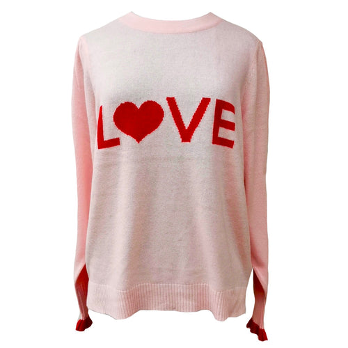 The Love Jumper by LAM in Pink/Scarlet has been intarsia-knitted with a luxury blend of cashmere and Extrafine Merino Wool to create this fun upbeat design.  The Puff shoulder and wider sleeve gives a feminine edge to this fun 70’s feel jumper. Featuring contrasting scarlet frill cuffs and back hem detail.  Teamed with wide leg shorts or bootcut jeans this jumper gives the perfect effortless look.