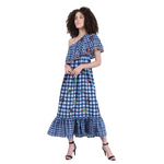 This cool blue gingham embroidered Moreena dress is by Conditions Apply. The dress is a classic one shoulder midi length in a crisp plaid print developed using light skin friendly cotton fabric that would be suitable for any day in the sun.  The beautifully embroidered frog motif adds a fun quirky twist to the statement dress. The dress has an elasticated bodice and delicate lace details at the edges of the overlap across the bodice which enhance the elegance. 